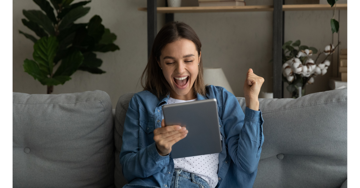 Woman on couch with tablet